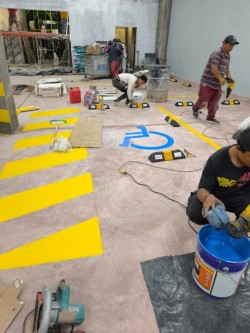 Proyecto de pintura de parqueaderos en TIA Ba&ntilde;os