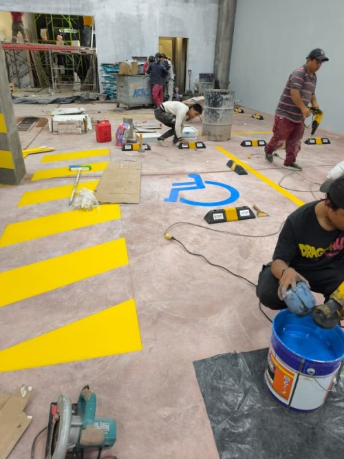 Proyecto de pintura de parqueaderos en TIA Ba&ntilde;os